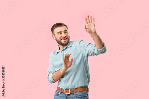 Handsome young man dancing ...