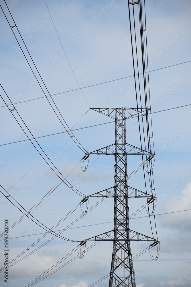 High voltage power lines across the sky.