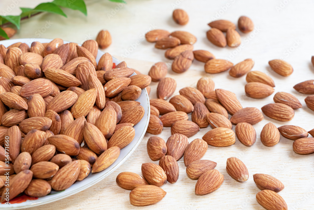 Almonds Delicious. Almonds isolated on white background. Almonds Delicious. Almonds isolated on white background.