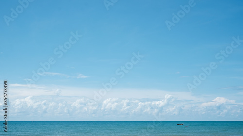 Beautiful nature view sea with white cloud and clear blue sky background, Summer and holiday with fine weather with cloudy and space of bright soft sky with blue sea © Adhivaswut
