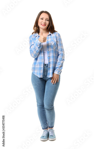 Beautiful young woman showing thumb-up gesture on white background