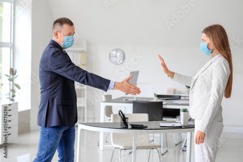 Colleagues greeting each ot...
