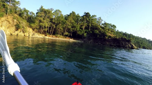 First person view Canoe riding across the shore over the sea on daylight at Gunluklu beach Fethiye Mugla Turkey photo