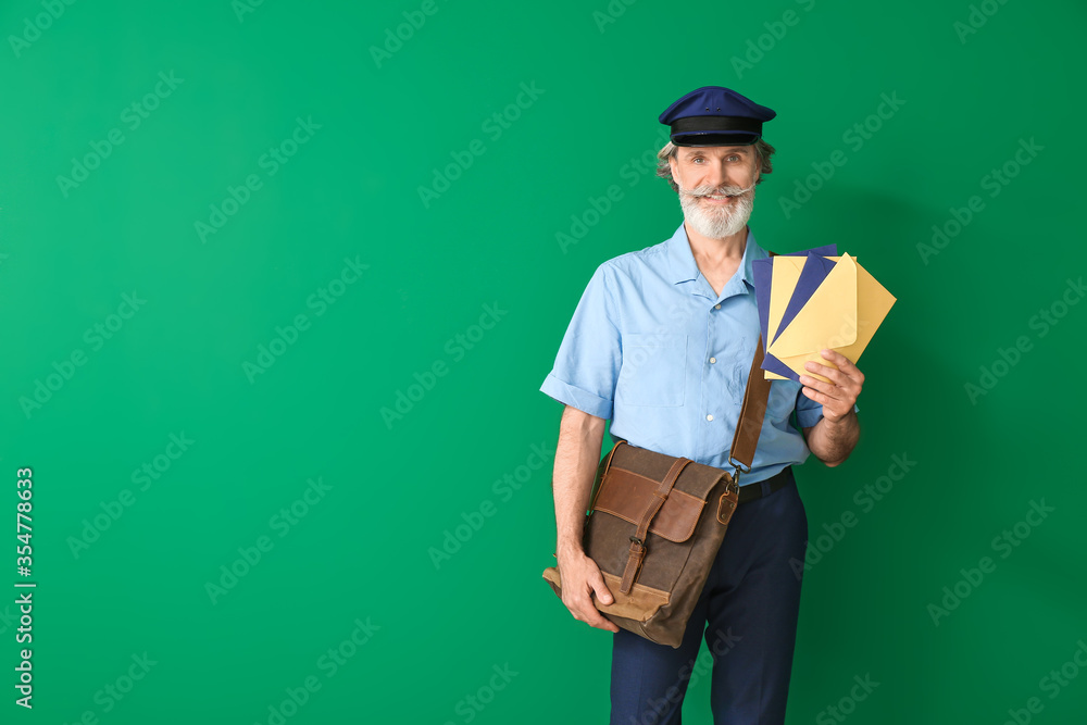 Handsome old postman on color background Handsome old postman on color background