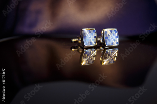 cufflinks close up. Fees the groom. Wedding details in blue