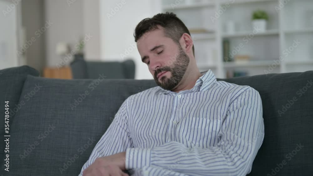 Tired Young Man taking Nap on Sofa Tired Young Man taking Nap on Sofa