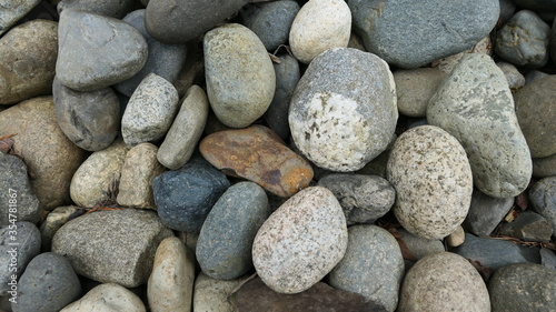 stones on the beach background texture or wallpaper