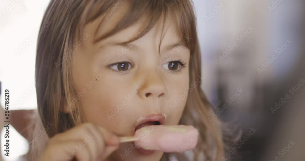 Adorable little girl licking ice cream Adorable little girl licking ice cream