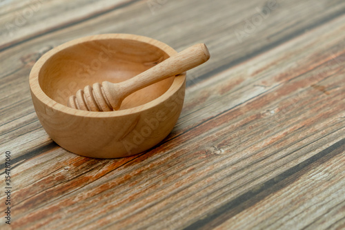 Close-up wooden bowl and wooden dripper on the floor