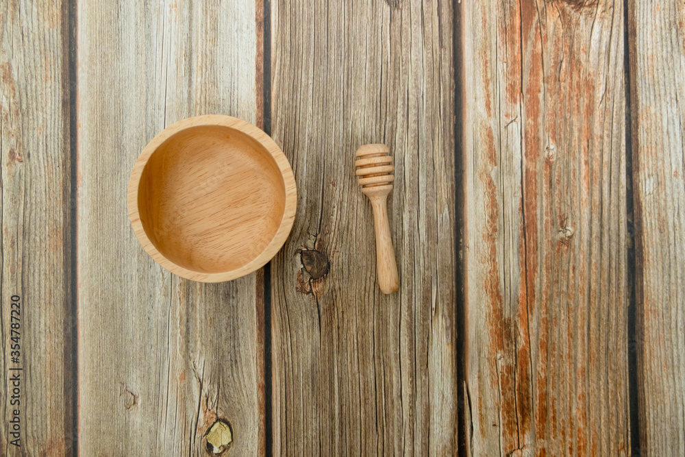 Close-up wooden bowl and wooden dripper on the floor Close-up wooden bowl and wooden dripper on the floor