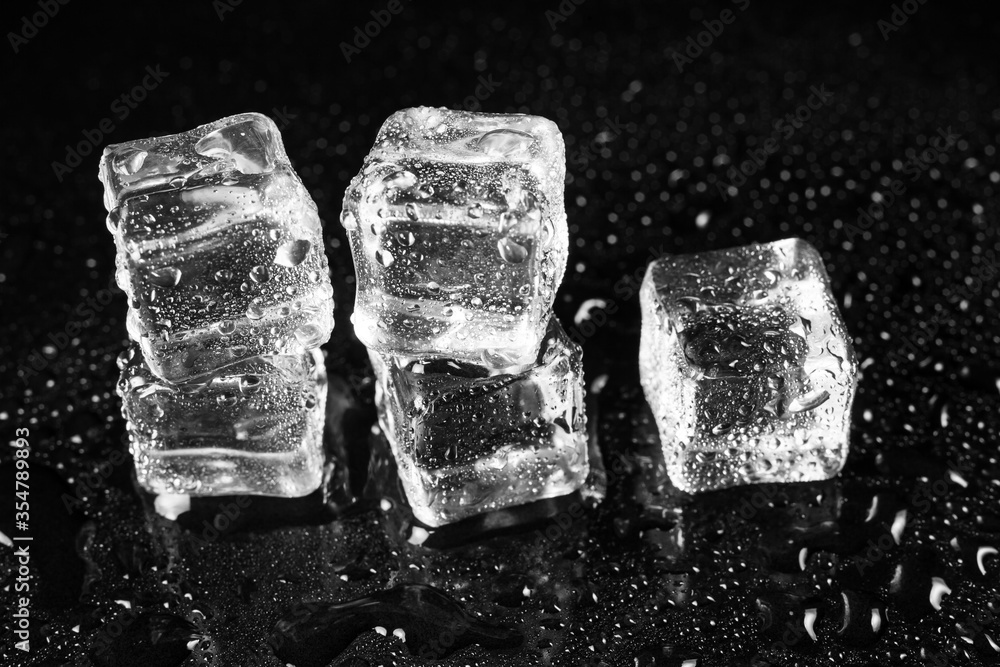 ice cubes on black table background. ice cubes on black table background.