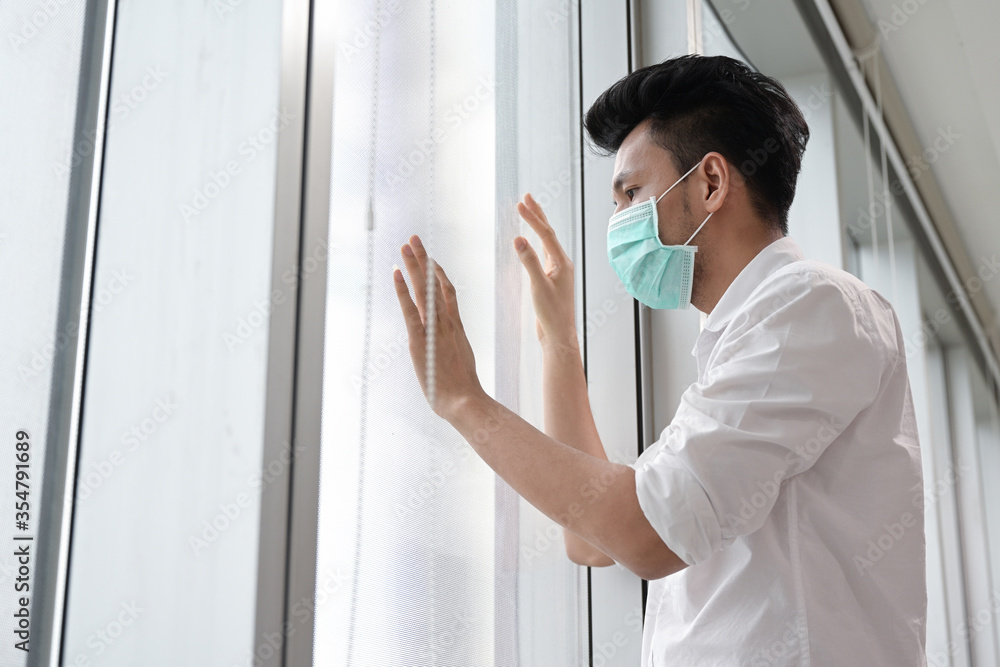 Fototapeta premium Patient man of coronavirus wear medical face mask during quarantine at home 