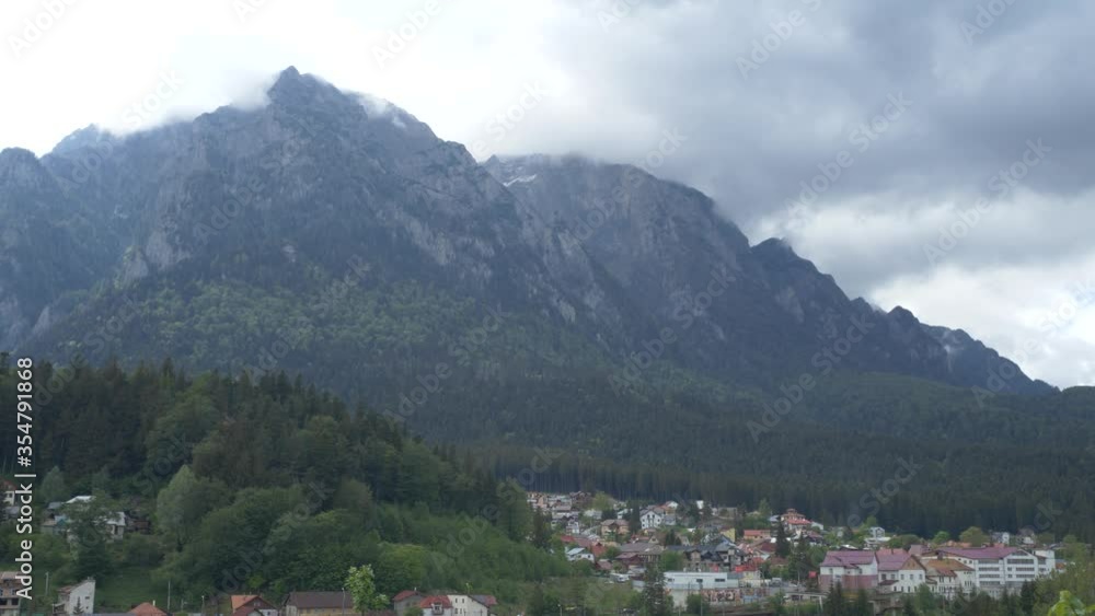 Perfectly Textured Mountain Time Lapse With Fast Moving Clouds, Nearby Tiny Village, Busteni, Romania Perfectly Textured Mountain Time Lapse With Fast Moving Clouds, Nearby Tiny Village, Busteni, Romania