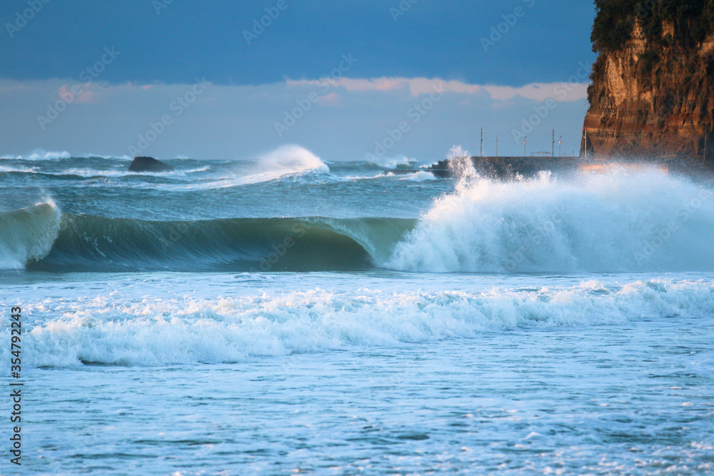 Obraz premium Large Waves from Typhoon, Hurricane, breaking, climate & ocean temperatures are rising, Surfing In Japan, Near Shidashita, Olympic Venue for surf.