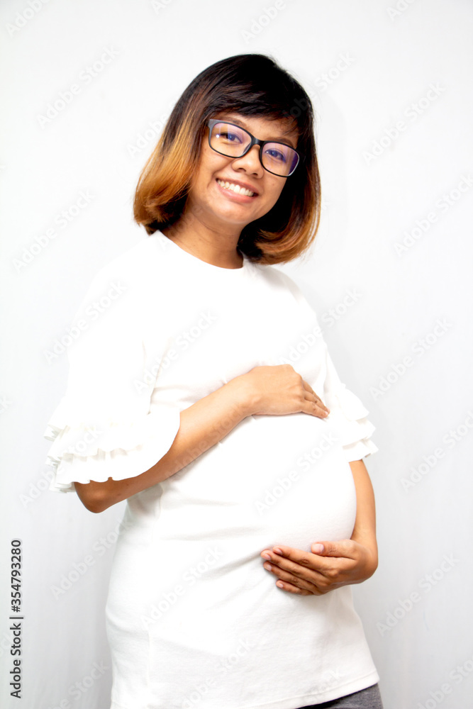 beautiful pregnant woman Standing to hold the stomach on a white background