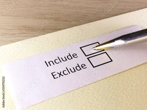 One person is answering question on a piece of paper. The person is thinking to include or to exclude.