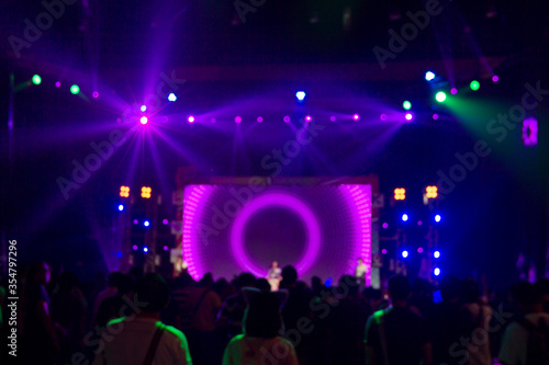 Bright colorful stage lights of purple blur background, Bokeh concert light