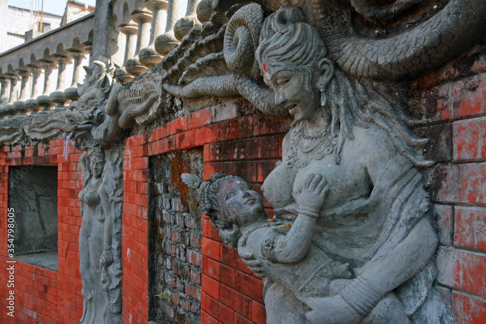Pokhra city,Nepal/27 December 2015 : Many temple and sculpture are in Nepal. some statue are most popular.the statue of the baby feeding in the picture