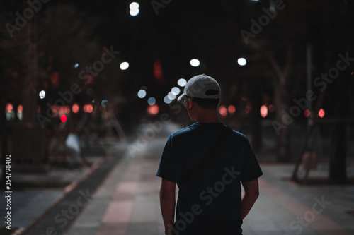
People standing back under the street lights