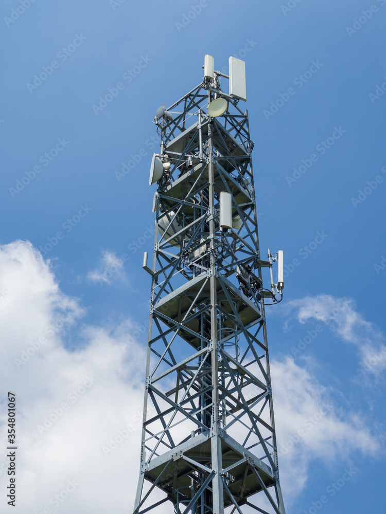 Group of antennas, satellite dishes for telecommunications, television broadcast, cellphone on mountain peak. Electromagnetic and environment pollution Group of antennas, satellite dishes for telecommunications, television broadcast, cellphone on mountain peak. Electromagnetic and environment pollution