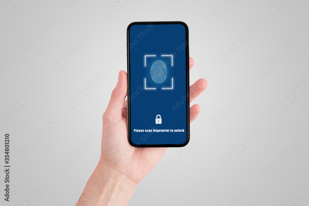 Technology, Internet, Digital and Networking Security Concept : Hand holding and showing fingerprint scan system on smartphone. Technology, Internet, Digital and Networking Security Concept : Hand holding and showing fingerprint scan system on smartphone.