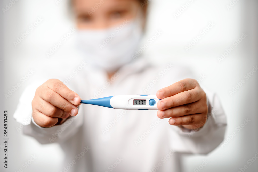 Coronavirus. 2019 Novel Coronavirus (2019-nCoV), a girl  and temperature on her thermometer. Isolated on white.