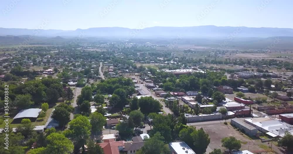 Drone flyover of small New Mexico town on a bright summer day. Drone flyover of small New Mexico town on a bright summer day.