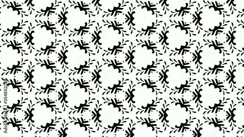 Animation of symmetrical pattern of floral black and white designs popping and fading slowly on white background. Seamless loop. Motion graphics. Animation of symmetrical pattern of floral black and white designs popping and fading slowly on white background. Seamless loop. Motion graphics.