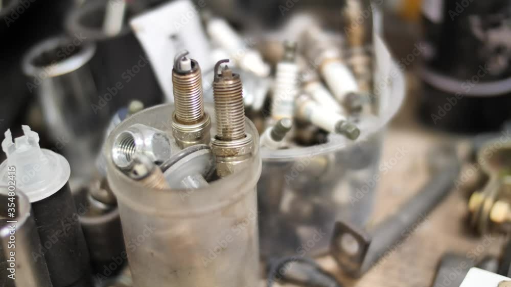 Socket wrench, bolt, spark plug, small mechanic parts for car repair Socket wrench, bolt, spark plug, small mechanic parts for car repair