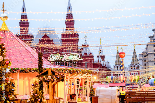 New year and Christmas in Moscow. Christmas market on red square. Christmas carousel near the Kremlin. Festive entertainment in Moscow. GUM store.
