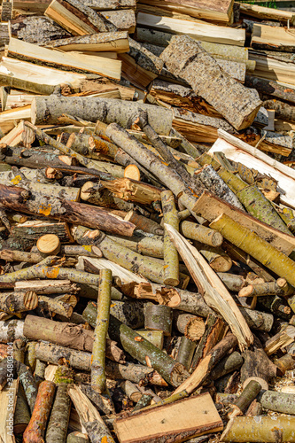 Wood waste is piled up for further processing into firewood
