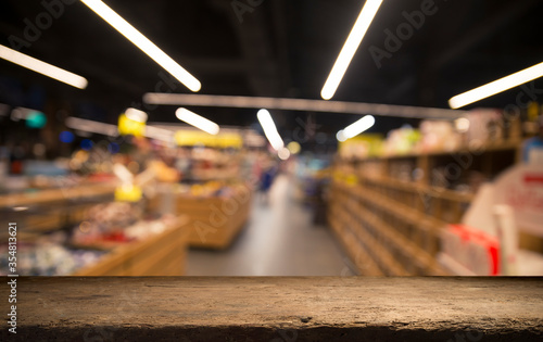 Wallpaper Mural Wood top table on blur supermarket background Torontodigital.ca