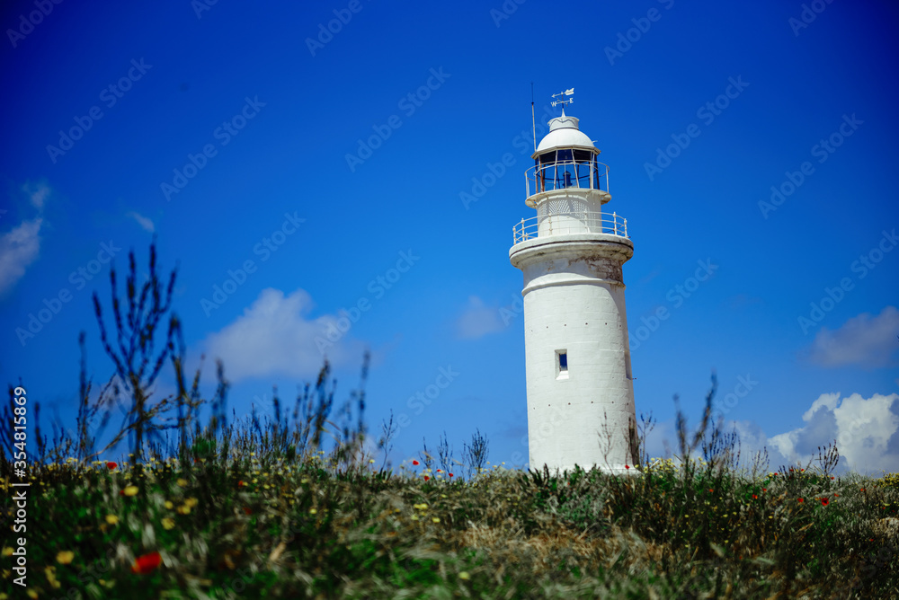 White pigeon point lighthouse with a blue sky in a sunny day