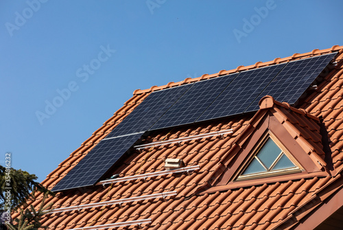 Solar electric panels on a house roof in Ochojno. Poland