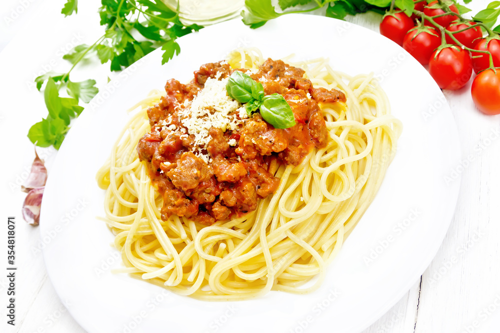 Spaghetti with bolognese on white wooden board Spaghetti with bolognese on white wooden board