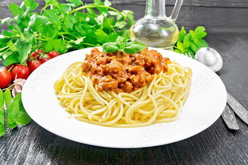 Spaghetti with bolognese on black board