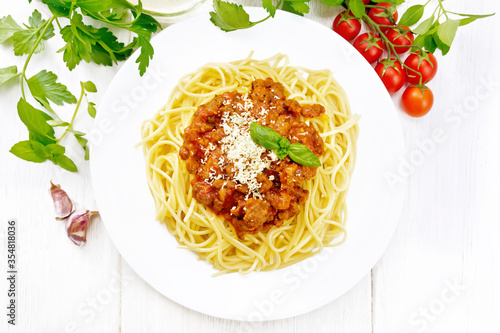 Spaghetti with bolognese on board top