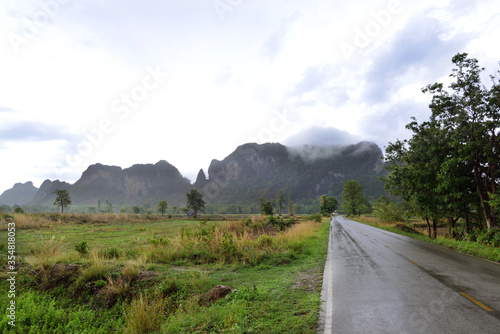 country road on rainy day in Thailand.