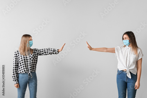 Young women greeting each o...