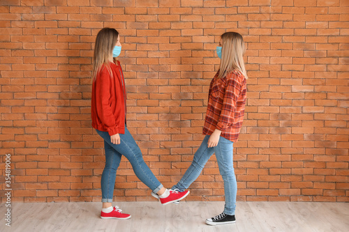 Young women greeting each o...