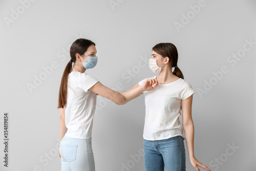 Young women greeting each o...