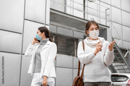 Young women in medical mask...