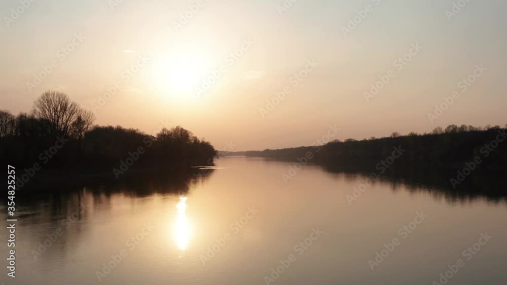 Sunset filmed with drone at the river. Slow forwarding drone filmed in 4k Sunset filmed with drone at the river. Slow forwarding drone filmed in 4k