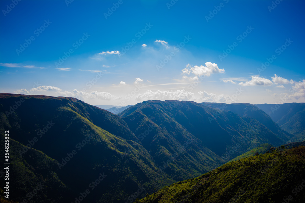 Natural view of the folded mountains and lush green valleys with clear sky and clouds of Cherrapunji, Meghalaya, North East India
Natural view of the folded mountains and lush green valleys with clear sky and clouds of Cherrapunji, Meghalaya, North East India