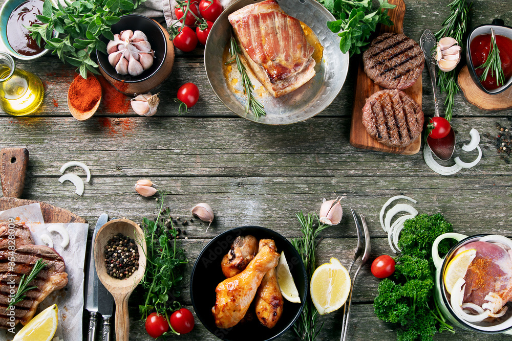 Grilled meat  on rustic wooden table - obrazy, fototapety, plakaty 