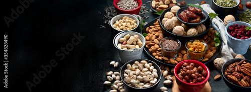 Obraz na plátně Different types of nuts, seeds and dried fruits