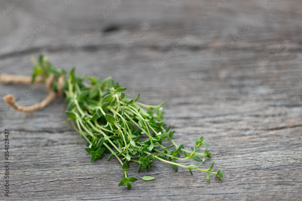 fresh thyme branch on wooden background fresh thyme branch on wooden background