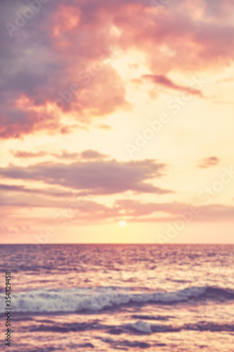 Blurred picture of ocean at sunset, summer vacation background. © MaciejBledowski