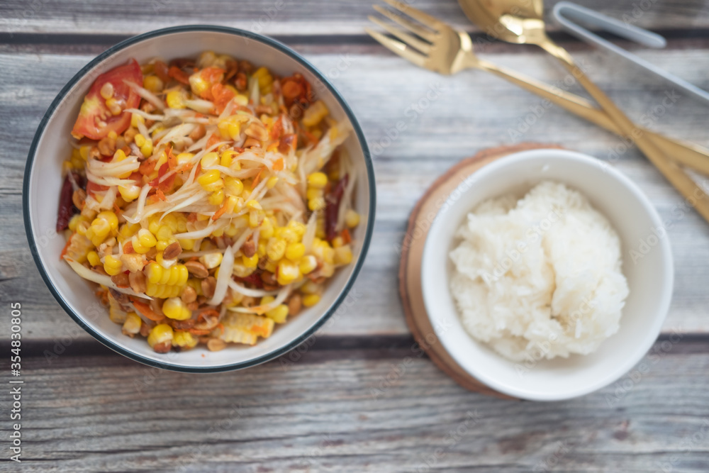 Somtum corn salad served with sticky rice Somtum corn salad served with sticky rice