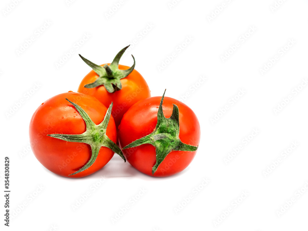 Fresh tomatoes with water droplet on peel isolated on white background. Fresh tomatoes with water droplet on peel isolated on white background.